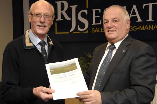 Colin Woodhead, left, accepts the golf vouchers from Ralph Shalom (RJS).