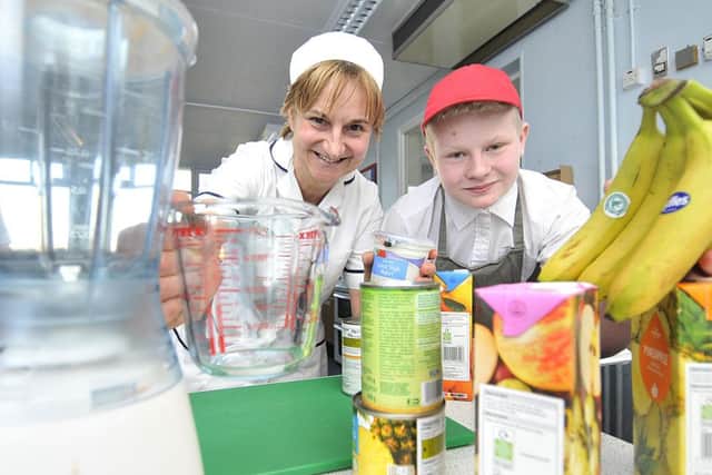 Filey Ebor Academy . Learning healthy food skills .Rachel Brickman of Hungate Health and Hygiene teaches about healthy food ideas with pupil Stuart Roodhouse.pic Richard Ponter170401a
