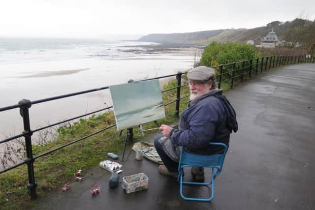 Professor Malcolm Ludvigsen just before the painting was blown away