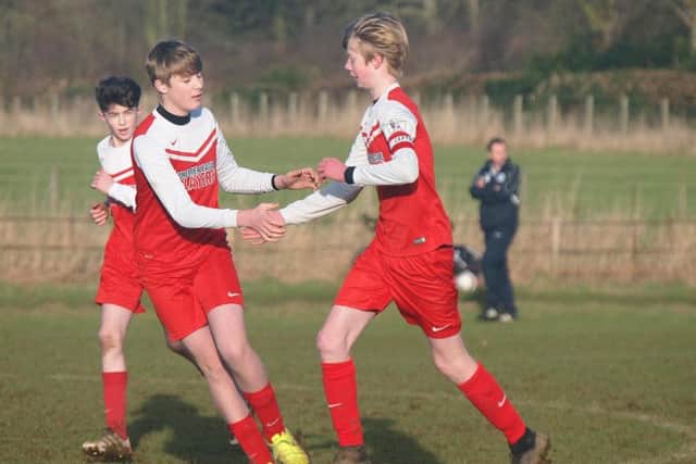 Scalby under-14s celebrate a goal