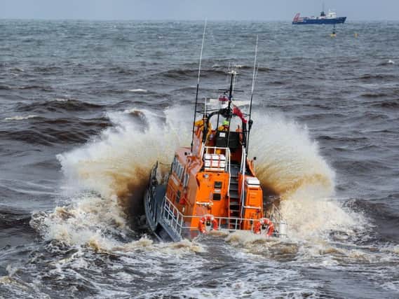 The Whitby lifeboat launches in rough seas. All pictures: Ceri Oakes