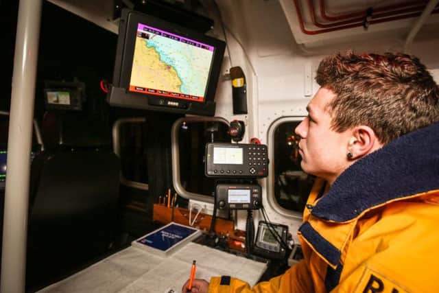 Crew member Shane Ingram inside the lifeboat