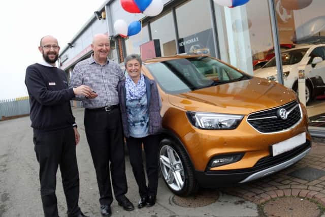 Sherwoods manager Simon MacConachie celebrates the 50th milestone with Pat and Brian Williams