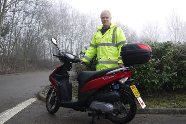Mark Hall, Wheels2Work co-ordinator, with one of the schemes mopeds