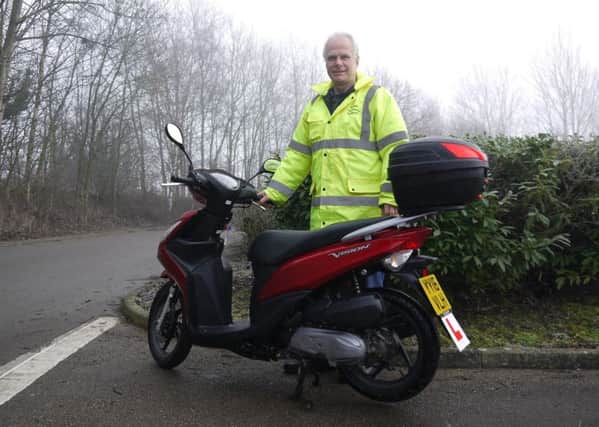 Mark Hall, Wheels2Work co-ordinator, with one of the schemes mopeds