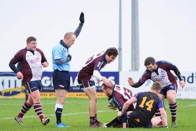 Tom Ratcliffe is congratulated after touching down for Scarborough RUFC. Picture by Andy Standing.