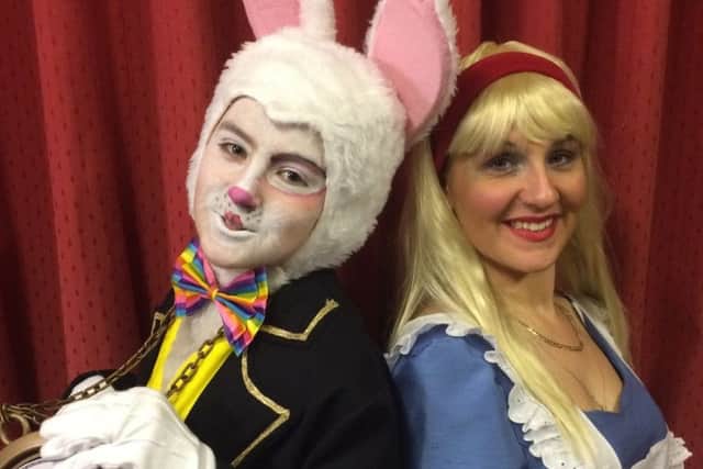 Emile Hazledine as White Rabbit and Joy Nurse as Alice