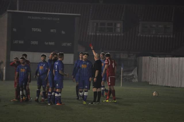 Niall Tilsley is given a red card by the referee