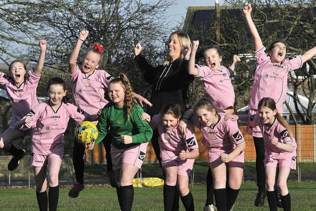 Filey Schools football stars, from left, Amelia Correia, Katie Unsworth, Sienna Hall, Olivia Coe, Claire Fenby (PE co-ordinator) Milly Keary, Millie Jarvis, Asha Poole, Jorji Crawford and Lily Hunter Picture by Richard Ponter (170408)