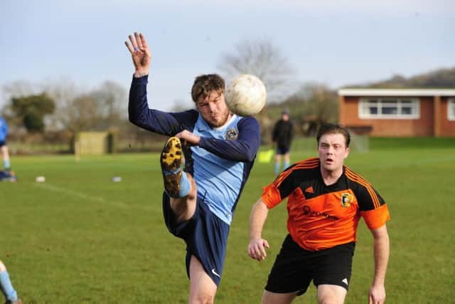 Whitby Fishermen in action during their District Cup semi-final at Edgehill, orange shirts