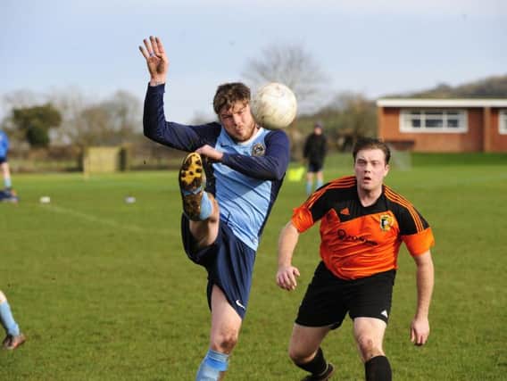 Whitby Fishermen in action during their District Cup semi-final at Edgehill, orange shirts