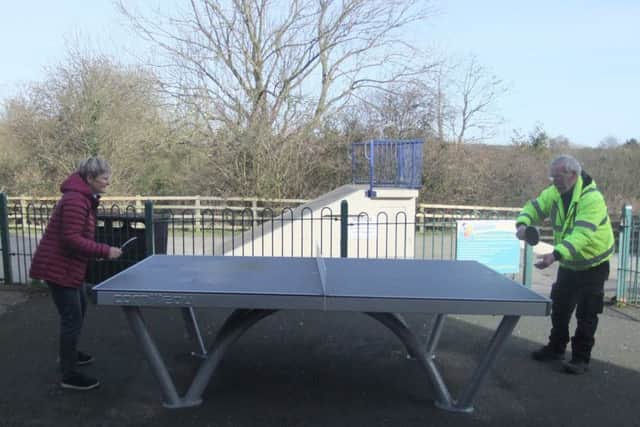 Councillor Helen Gorton and caretaker John McCormick test out the new table tennis equipment