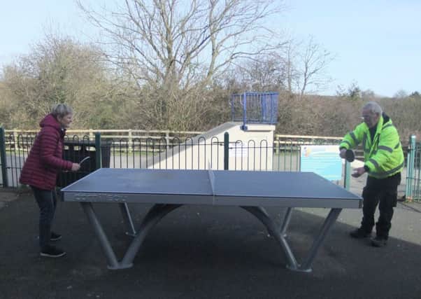 Councillor Helen Gorton and caretaker John McCormick test out the new table tennis equipment