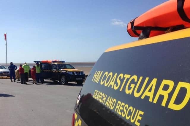 The woman and dog were rescued from the sea.