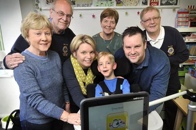 Charlie Hall meets fundraisers at his home in Scarborough .Salt Trustee Rosemary Forrest,Lions President Gareth Jones,Mum Olivia Stirling, Charlie , Dad Iain Hall,Salt volunteer Carole Harper,Lions representative Robert Hunter. pic Richard Ponter 170815a