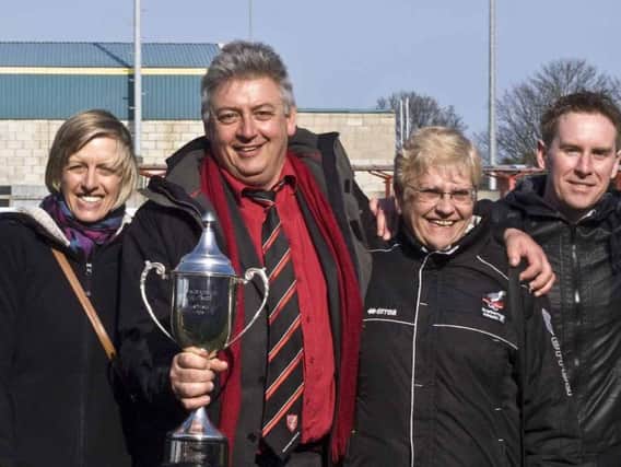 Dave Holland, second left, pictured holding the NCEL Premier trophy with Wendy Danby, Sandra Troughton and Geoff Osguthorpe