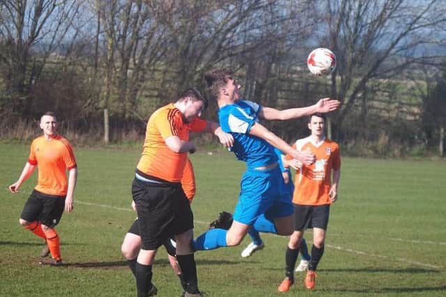 Kieran Link wins a header for Trafalgar in their 7-0 win against Thornaby Roundel. Picture by Steve Lilly.