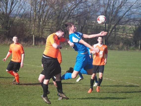 Kieran Link wins a header for Trafalgar in their 7-0 win against Thornaby Roundel. Picture by Steve Lilly.