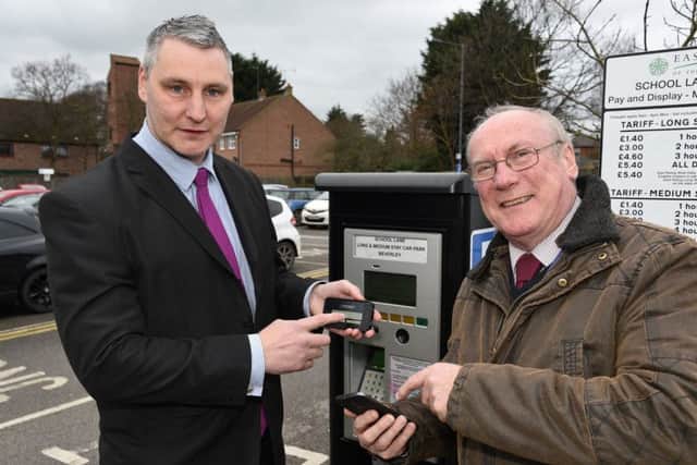 Introducing the new mobile pay methods are David Hepworth, parking operations manager, and Councillor Andy Burton.