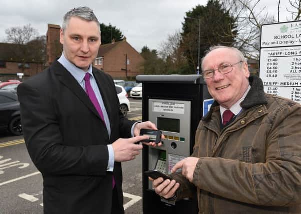 Introducing the new mobile pay methods are David Hepworth, parking operations manager, and Councillor Andy Burton.