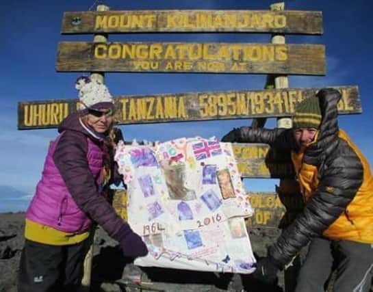 Sharron and Chris Rogers at the top of Mount Kilimanjaro.