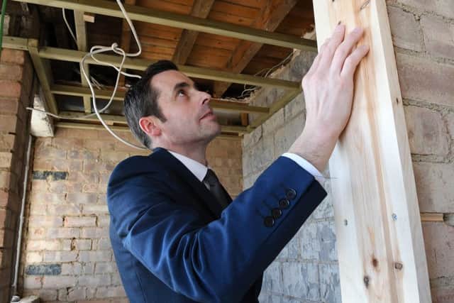Paul inspects work on one of the room upgrades.