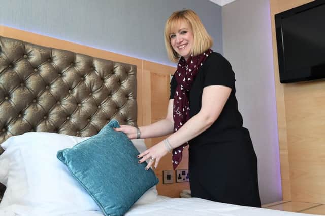 Ellie gets the room ready for the next guests