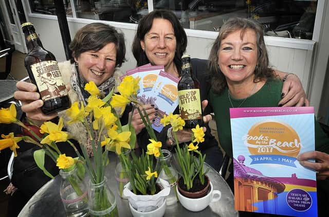 The Watermark Cafe celebrating Books on the Beach and Wold Top Brewery  . Gill Mellor from Wold Top Brewery,Watermark owner Gill Partridge and Books by the Beach organiser Heather French