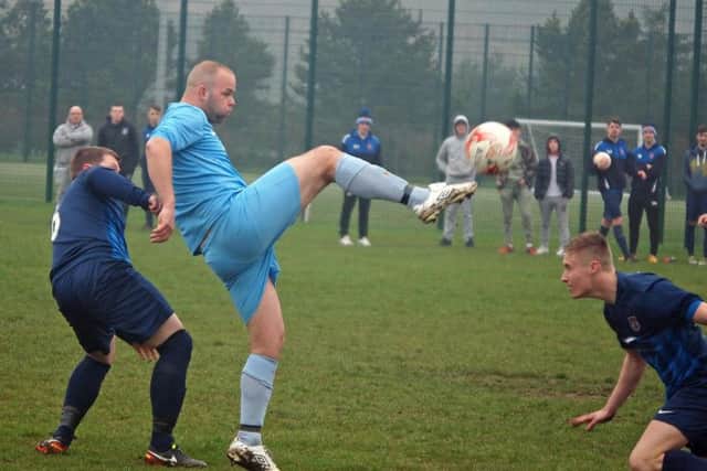 Traf's Jimmy Beadle brings the ball down v Angel