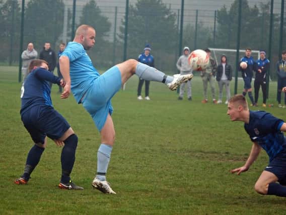 Traf's Jimmy Beadle brings the ball down v Angel