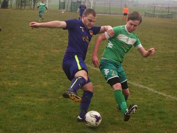 Niall Prentice in action during Goalsports' 3-0 home win against Fishburn Park Reserves, green kit