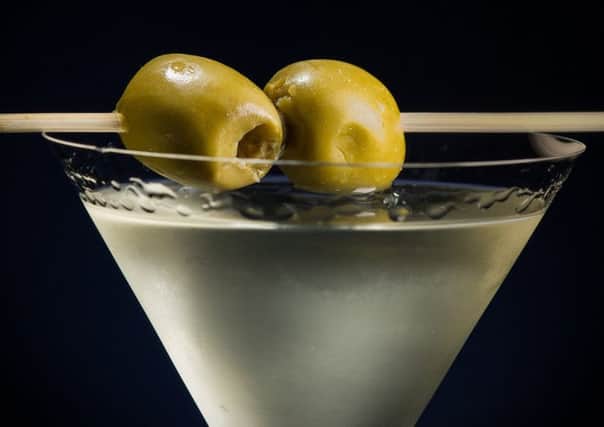 Getting the day off to a good start with two olives in a breakfast Martini.