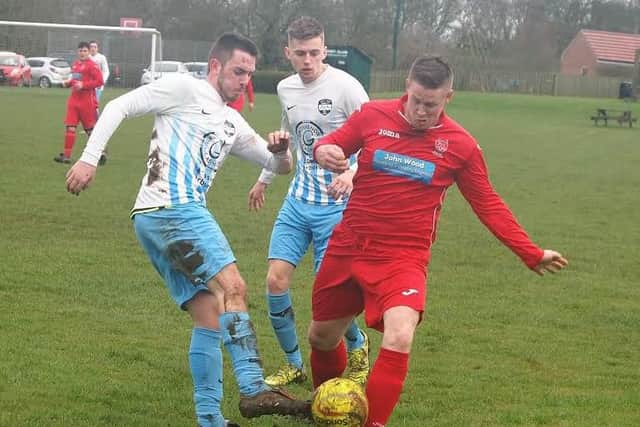 Newlands' Drew McCoubrey battles for the ball during his side's 3-1 League Cup semi-final win against Itis Itis Rovers. Picture by Steve Lilly.