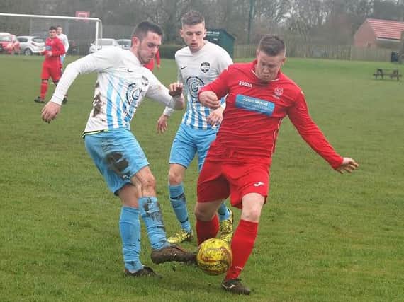 Newlands' Drew McCoubrey battles for the ball during his side's 3-1 League Cup semi-final win against Itis Itis Rovers. Picture by Steve Lilly.