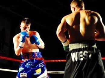 George Rhodes in action against Dan West. Pictures by Andy Standing.