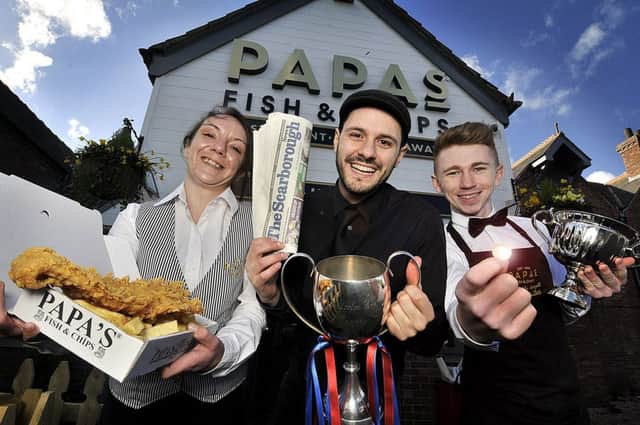 Papas staff Hannah Willson, George Papas and Ryan Tarry celebrating their success by offering 1p fish and chips in Scarborough