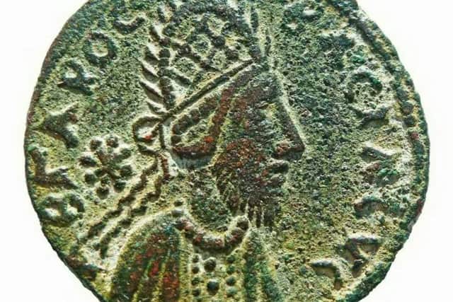 The tiny bronze coin, dating from the 1st-century AD, has what an author says is the only lifelike image ever made of Jesus.