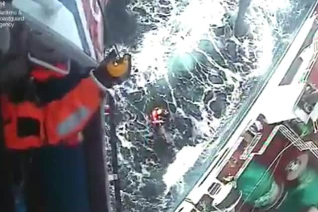 The man is airlifted from the vessel. Scroll down for video. Picture: Maritime and Coastguard Agency.