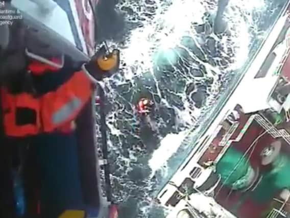 The man is airlifted from the vessel. Scroll down for video. Picture: Maritime and Coastguard Agency.