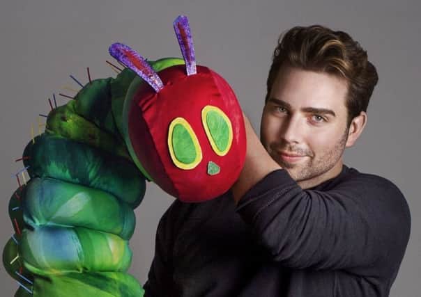 Director Jonathan Rockefeller with a caterpillar puppet