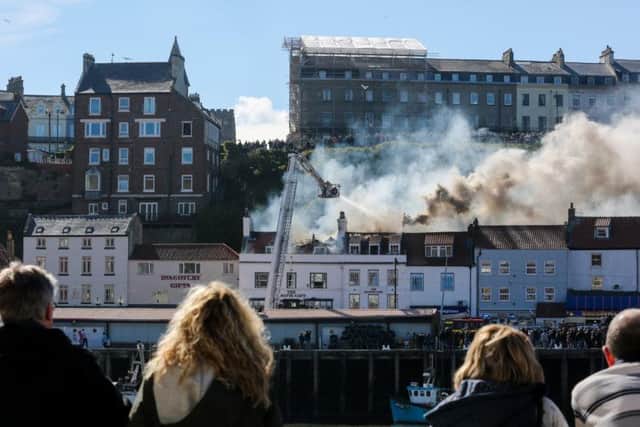 Residents and visitors watch in shock as emergency services tackle the second fire
Picture by Ceri Oakes