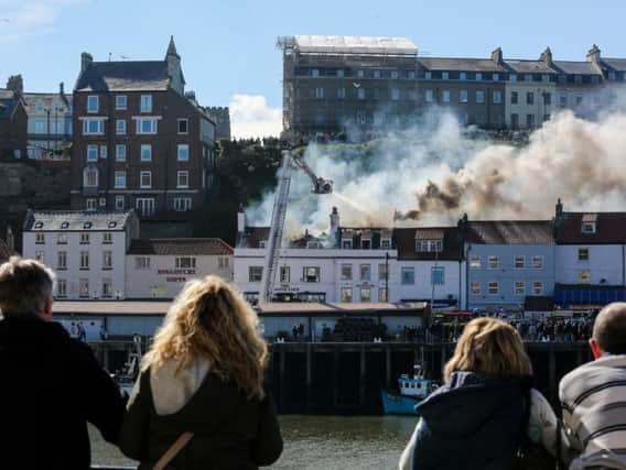 Residents and visitors watch in shock as emergency services tackle the second fire
Picture by Ceri Oakes