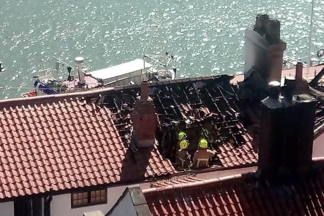 Firefighters are dampening down