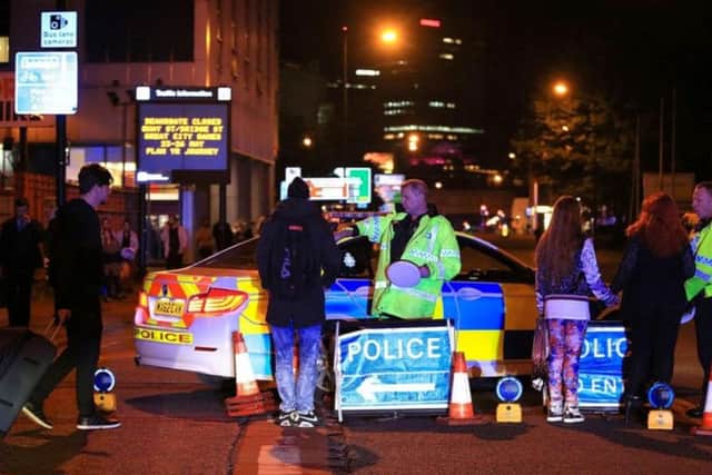 Emergency services at Manchester Arena after reports of an explosion at the venue during an Ariana Grande gig. Peter Byrne/PA Wire