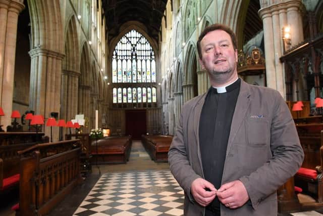The Rev Matthew Pollard inside the Priory