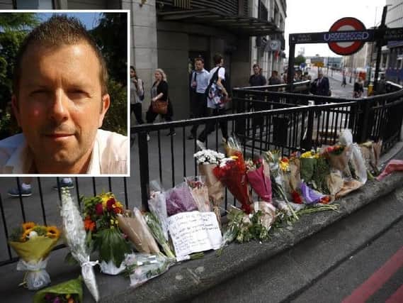Flowers left at the scene in London and, inset, Mark Townsend