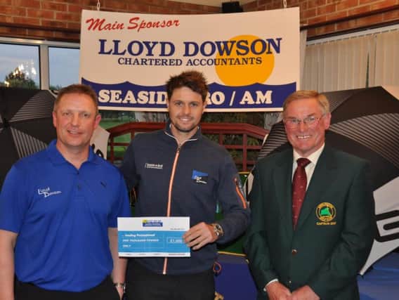 Alex Belt receiving the winning Seaside Pro/Am Professional Cheque from Simon Nuttall (Lloyd Dowson) and Paul Redhead (Captain Bridlington Golf Club)