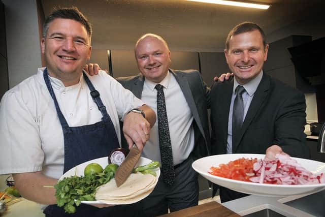 Celebrity chef Peter Sidwell with Castle Interiors staff Charles Thompson and Paul Stephenson. PIC: Richard Ponter