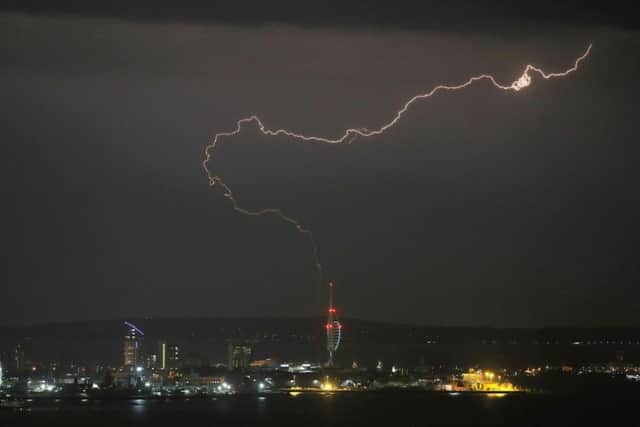 A lightning bolt over the Spinnaker Tower, Portsmouth last night as storms moved up the country toward Yorkshire. Picture: Steve Parsons/PA Wire