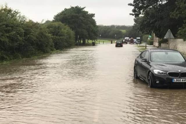Cars were left abandoned in the flood water